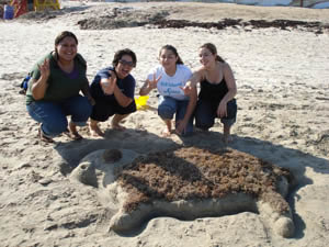 UH students Jael Medrano, Dominique Lin, Adriana Rodriguez and Patricia Sanmiguel participate in a sand sculpting competition during the Women-in-Engineering Retreat on Sept. 8. The students were challenged to create their favorite marvel of engineering and this group decided to sculp Dolly the Sheep, the first mammal successfully cloned. Photo provided by Julie Trenor
