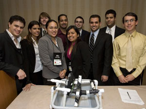 Rehan Momin (back row, second from left), senior electrical engineering major, is pictured with his design team at the Society of Hispanic Professional Engineers national conference. The team captured first place in the organization's Extreme Engineering Challege, a competition challenging students to design a water supply system for an impoverished country. Photo courtesy of SHPE.