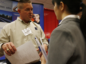 EPCO Inc. recruiter John Jewitt visits with a student at the 2008 Engineering and Technical Career Fair held on Feb. 6. EPCO Inc. was a platinum sponsor for the event, along with Baker Hughes, CGGVeritas, Fluor Daniel, Jacobs Engineering and Kiewit Corporation. Photo by Todd Spoth.