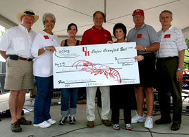 The Crawfish Boil Committee presents Dean Joseph Tedesco (center) with a $150,000 check for student scholarships. Pictured are Gary Hurta (1972 BSME); Vita Como, director of the Cullen College of Engineering Career Center; Janice Quiroz, special events coordinator; Dean Tedesco; Diana Ashen, event chair; Gregory Williams (1979 BSME); and Benton Baugh (1967 BSME). Photo by Tom Shea.