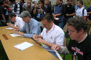 Electrical and Computer Engineering Professors (from left) Len Trombetta, Stuart Long, Valery Kalatsky and David Shattuck compete in the infamous Slide Rule Contest at the 29th Annual IEEE Chili Cook-Off. Photo courtesy of Loretta Herbek.