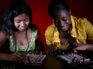 GRADE campers participate in a game of circuit Bingo, one of many activities designed to open young girls minds to science and engineering, during the final week of the UH camp. Photo by Thomas Shea.