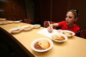 KBR's Stacey Lanza was one of four judges who waded through 20 bowls of chili to find winners in the student organization and company categories of the chili contest. Photo by Erin D. McKenzie.