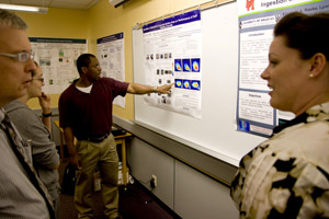 Work by participants in the college's Research Experience for Teachers (RET) program was highlighted recently at a poster session. Photo by Thomas Shea