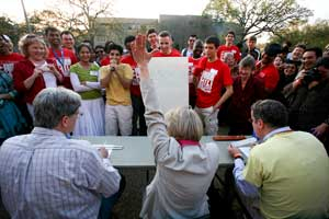 UH engineering faculty, Stuart Long, Kathy Zerda and Dave Shattuck, compete in the slide rule competition at the chili cook off. Photo by Thomas Shea.