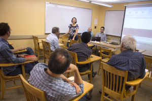 Nicole Neveu, leader of the NASA-sponsored senior design team, presents their small satellite antenna design to their faculty advisors and sponsors.