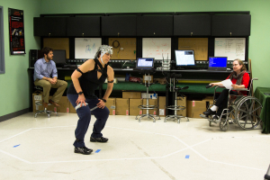 Karen Studd, professor of dance at George Mason University, performs a dance while her brain waves are recorded through an EEG skull cap (pictured).