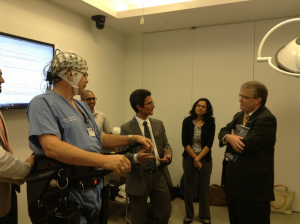 Prof. Contreras-Vidal explains to Rep. Culberson (right) how the brain-machine interface to the Rehab Rex exoskeleton works. 