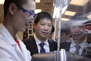 Dr. Yan Yao guides graduate student through a lab demonstration.