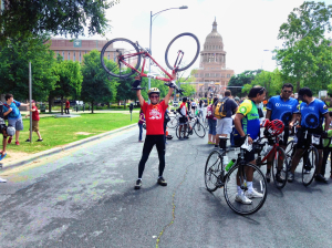 Professor "Pepe" Contreras-Vidal celebrates at the finish line of the 29th annual BP MS 150 outside of the Texas State Capitol in Austin.