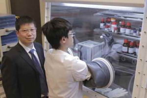 Yan Yao in his lab with a student researcher.