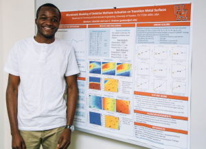 Abraham Aboiralor stands beside award-winning poster.