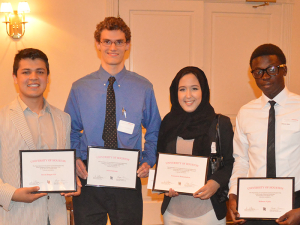 Ridwan with certificate for scholarship at the Civil Engineering Induction Ceremony