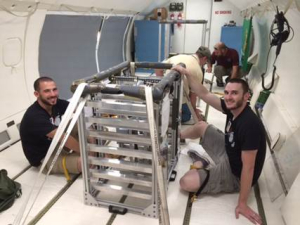 Team NEO inside of the "vomit comet" with their experiment.