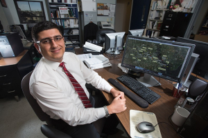 At the controls: Environmental engineering Ph.D student Amin Kiaghadi studies bodies of water to develop his ideas