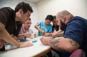 Team effort to build the hand: (L-R) Jalal Yazji, Daniel Bahrt, Rafael, Maria Sanchez and Daniel Ramirez