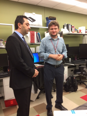 Ferhat Alkan (L), Houston's Turkish consul general, visits with biomedical Professor Sergy Shevkoplyas