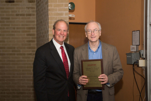 Joseph W. Tedesco, left, presents plaque to Engineering Rockwell lecturer Ronald Larson