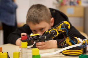 Oliver, a fourth grader at UH Charter School, is keen on learning about robots
