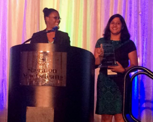 Aparna Balasubramani, right, with her award