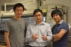 Cunjiang Yu, Bill D. Cook Assistant Professor of mechanical engineering, center, and co-first authors Xu Wang, left, and Kyoseung Sim, right)