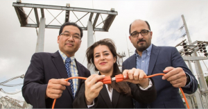 Powering up: Saeedeh Abbasi (center) works to restore power with the help Gino Lim and Masoud Barati