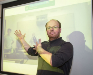 Konrad Krakowiak welcomes MIT students into his classroom via the big screen