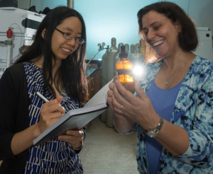 A ray of hope: Stacey Louie, assistant professor of civil and environmental engineering, left, and Debora Rodrigues, associate professor of civil and environmental engineering, examining nanoparticles, to find new materials that will break down pollutants and work in sunlight