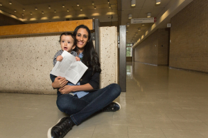 'I almost feel I have given birth to two babies,' says grad student Sana Krichen. Her son Youssef Khadimallah, now 10 months old, holds his mother’s just-published article about the role electromagnetism plays in some animal species’ navigation skills. The article was first submitted to the journal Physical Review E at the time Krichen learned she was pregnant and – after much back-and-forth with reviewers – was released October 4.