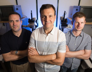 Peter Vekilov, center, with Jeffrey Rimer, left, and Jeremy Palmer, right, in front of the big guns - the atomic force microscopes,