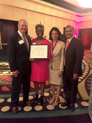 Delvina Branch, winner of a President's Excellence Award, with Renu Khator, UH president; Joseph W. Tedesco, Elizabeth D. Rockwell dean of the UH Cullen College of Engineering; and Suresh Khator, associate dean of graduate programs and computing facilities at the Cullen College.