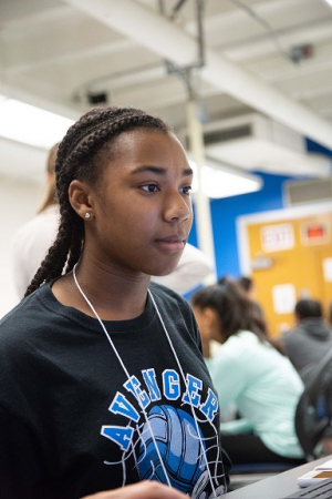 D'Nari Mills, a 9th grader from Cypress, is enjoying making friends while building a robot at the UH G.R.A.D.E. Camp.