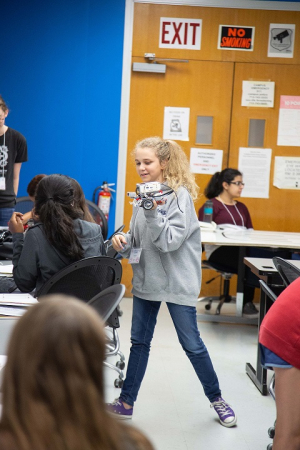 Natalie Cramer, a student from Pearland, is enjoying building her robot at the 2018 G.R.A.D.E. Camp at the University of Houston.