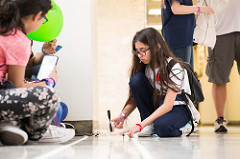 A girl tests her propeller-powered car at the 2018 Girls Engineering the Future! at the UH Cullen College.