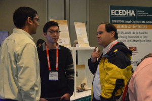 University of Houston engineering students Kaushik Mandiga and Denny Luong visit with industry professionals at the 2018 ECEDHA Conference.