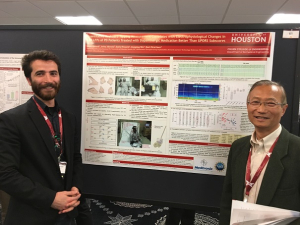 Musa Ozturk, a UH graduate student, stands in front of the award-winning poster with Jianping Wu, senior principal scientist at Medtronic and co-author of the study.