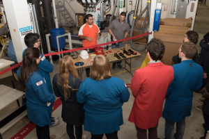 ExxonMobil employees Isaac Falcon (left) and Shannon Hebert (right) discuss Personal Protective Equipment (PPE) commonly used in its laboratory facilities