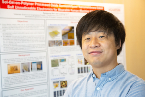 Kyoseung Sim, a Cullen College of Engineering alumnus, with his award winning poster.