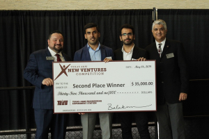 Hadi Ghasemi, Bill D. Cook Assistant Professor of mechanical engineering at the UH Cullen College of Engineering, accepts his 2019 Texas A&M New Ventures Competition (TNVC) winnings.