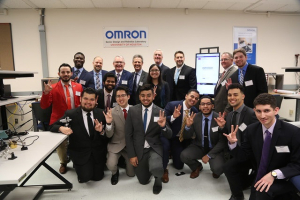 Omron representatives pose with UH electrical and computer engineering students.