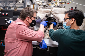 Dr. Lars C. Grabow [left] working with postdoctoral researcher Debtanu Maiti in the lab. 