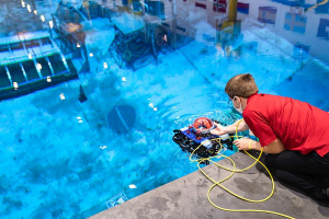 Assistant Professor Aaron Becker and robotic swarm lab members conduct tests of a submersible ROV pairing at the Neutral Buoyancy Lab in August.