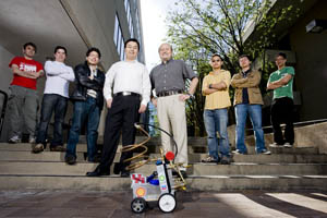 Students from the Chem-E Car Team pose with their advisor, and the Cougalac. Photo by Thomas Shea. 