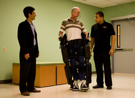 Professor Jose Luis Contreras-Vidal (left) at a recent demonstration of a Rex Bionics exoskeleton at the University of Houston. Contreras-Vidal is developing a brain-machine interface that will allow users to control such devices through their thoughts. Photo by Nine Nguyen.