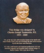 The plaque honoring Cullen College Alumnus C.J. Tamborello at the pedestrian bridge crossing Sims Bayou in FM Law Park.