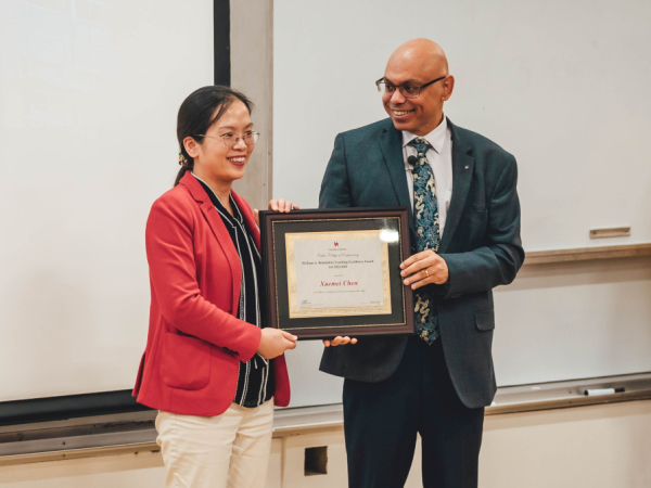 [left] Xuemei Chen, instructional associate professor in the Mechanical Engineering Department, receives the William A. Brookshire Teaching Excellence Award from Pradeep Sharma, Interim Dean of the Cullen College of Engineering and Hugh Roy and Lillie Cranz Cullen Distinguished University Professor.  