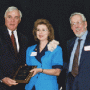 UH President Arthur K. Smith and George Magner present Shirley Mate with the 2001 George Magner Award for Excellence. 