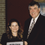 Dean Flumerfelt presents the Dean's Meritorious Staff Award to Mary Schulz.