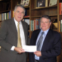 John Duty, executive vice president of Bechtel, Inc., presents Dean Flumerfelt with a check for scholarship support on behalf of the Bechtel Group Foundation.