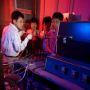 Assistant Research Professor Qingkai Yu working in the lab with electrical and computer engineering graduate students Zhihua Su and Wei Wu and postdoctoral researcher Zhihong Liu. Photo by Thomas Shea. 